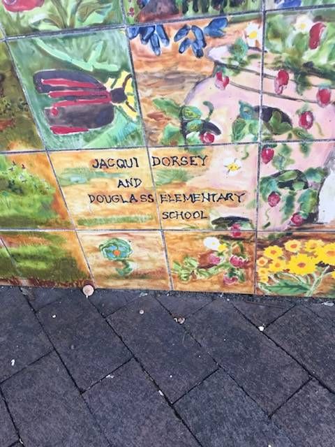 A picture of the passage shown on the lower left of The Founding Mother's Mural which reads: "Jacqui Dorsey and Douglass Elementary School"